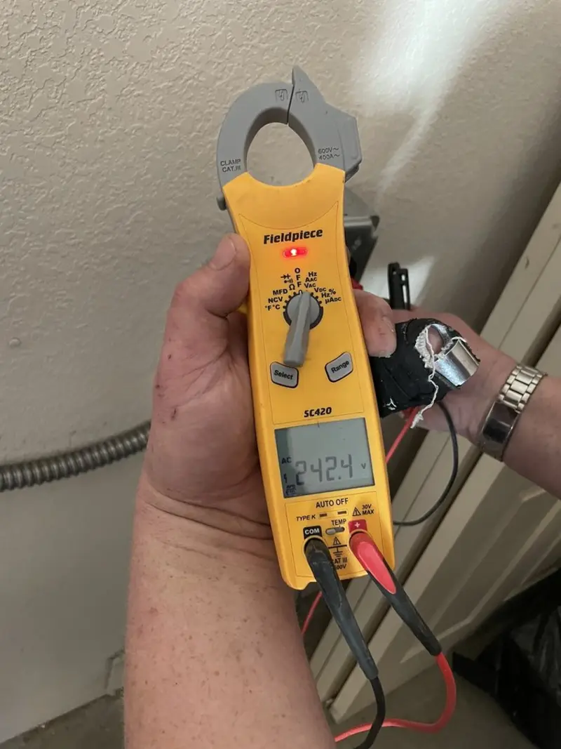 Voltage testing with clamp meter during Recessed Lighting Installation in Sandusky